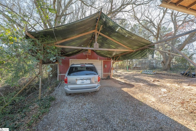 view of car parking with a garage