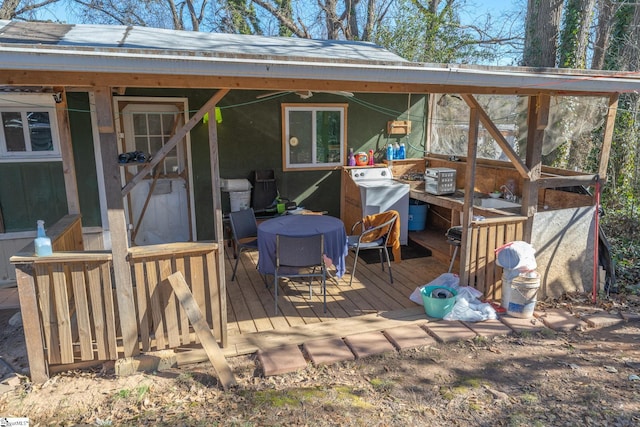 wooden terrace with area for grilling