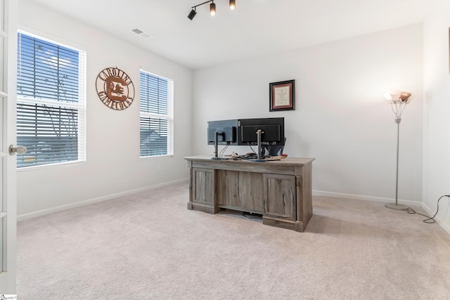 office space with light colored carpet