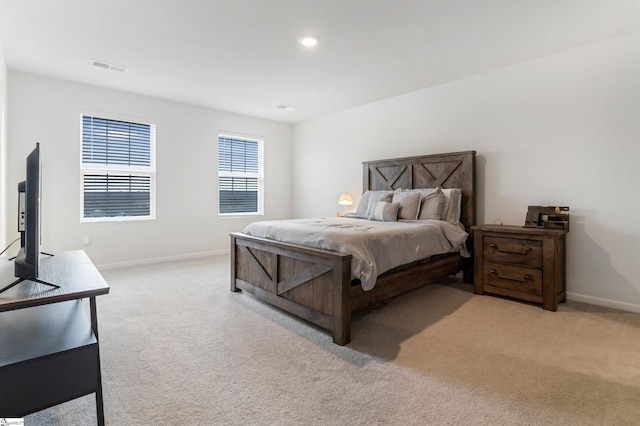 bedroom with light colored carpet