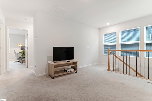 living room featuring light colored carpet