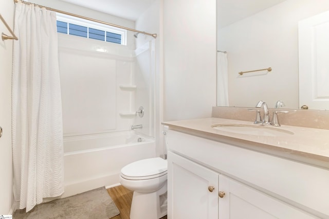 full bathroom with vanity, wood-type flooring, toilet, and shower / bath combo with shower curtain