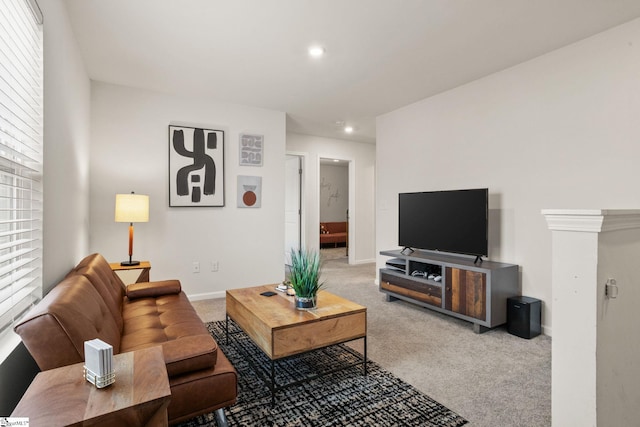 living room with a healthy amount of sunlight and carpet