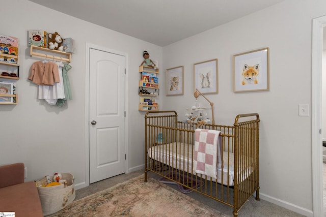 carpeted bedroom with a crib