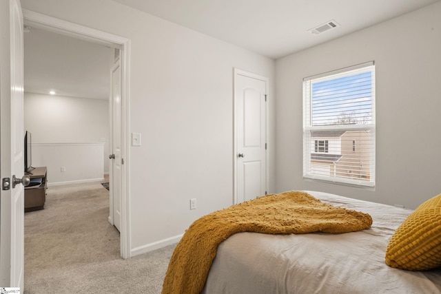 bedroom with light colored carpet