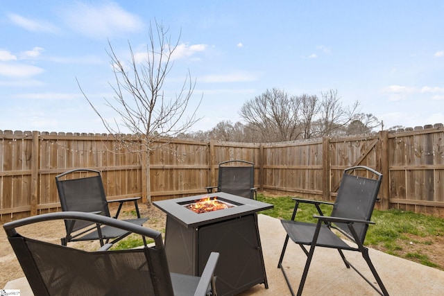 view of patio / terrace featuring an outdoor fire pit