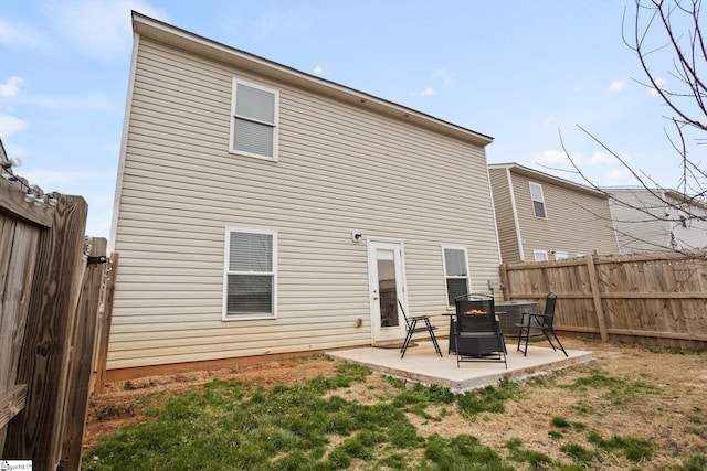 rear view of property featuring a patio area