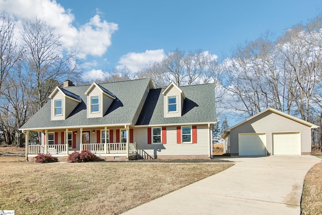 new england style home with a garage, an outdoor structure, covered porch, and a front yard