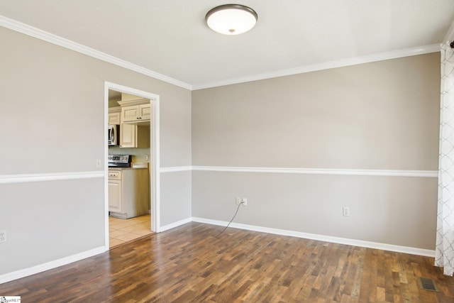 unfurnished room with hardwood / wood-style flooring and ornamental molding