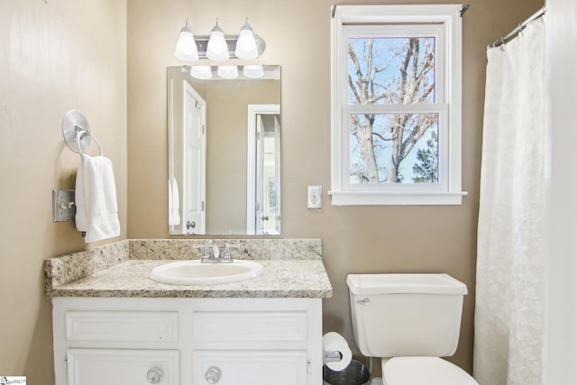 bathroom with vanity and toilet