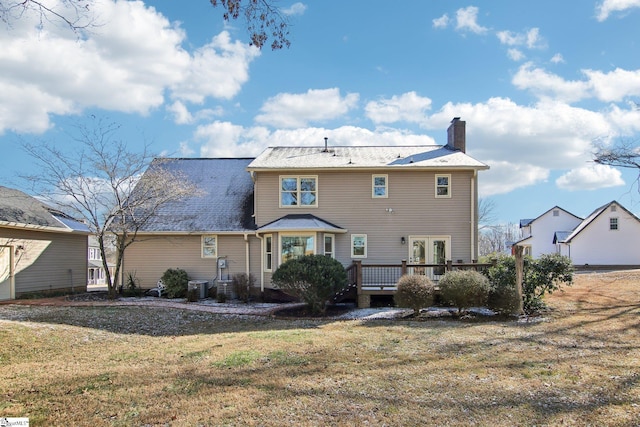 back of property featuring a yard, central AC, a deck, and french doors