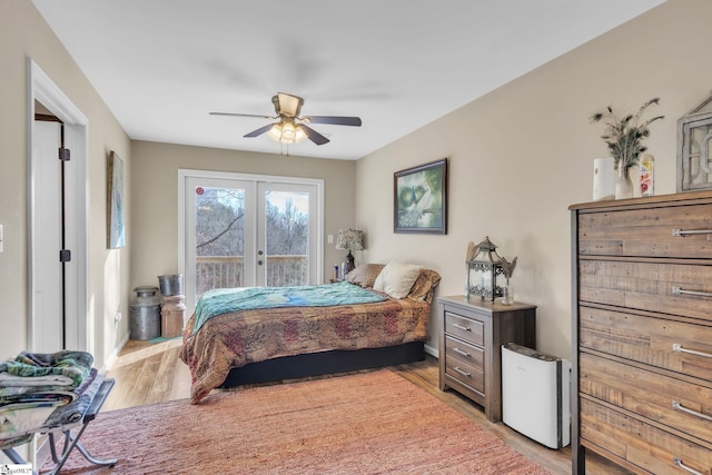 bedroom with light hardwood / wood-style flooring, access to outside, french doors, and ceiling fan