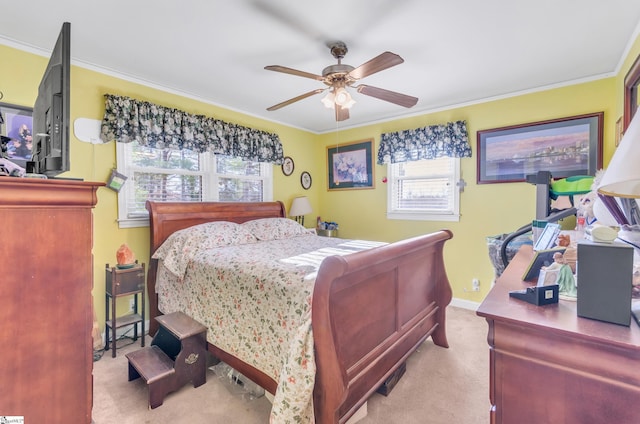 carpeted bedroom with crown molding and ceiling fan