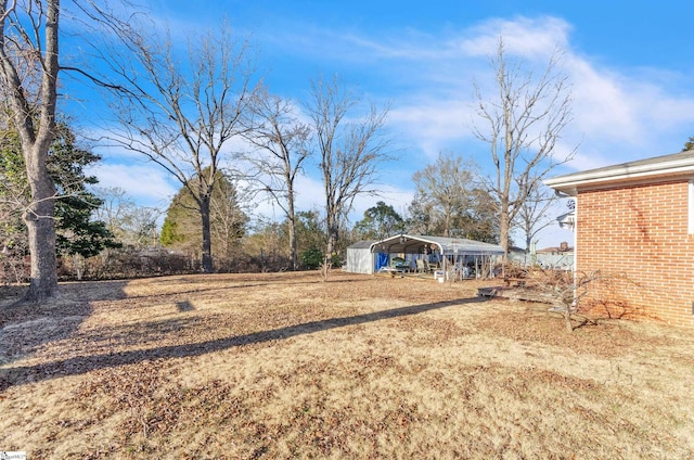 view of yard with a carport