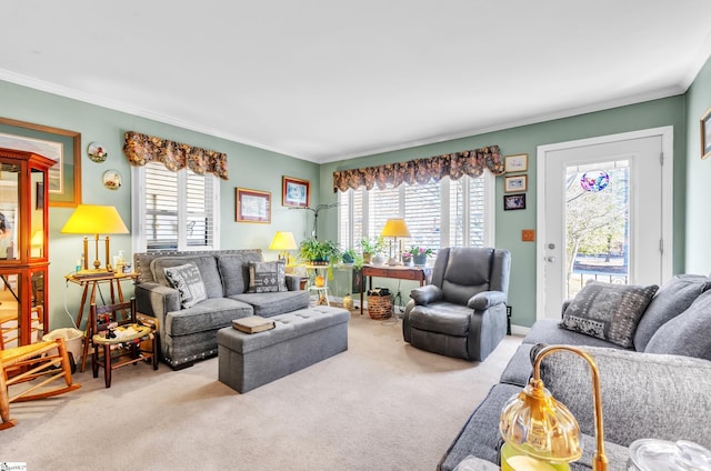 living room featuring light colored carpet, plenty of natural light, and ornamental molding