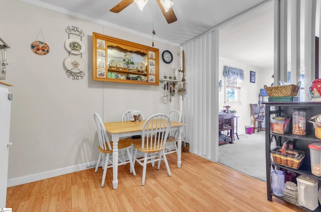 dining room featuring crown molding, ceiling fan, and light hardwood / wood-style flooring