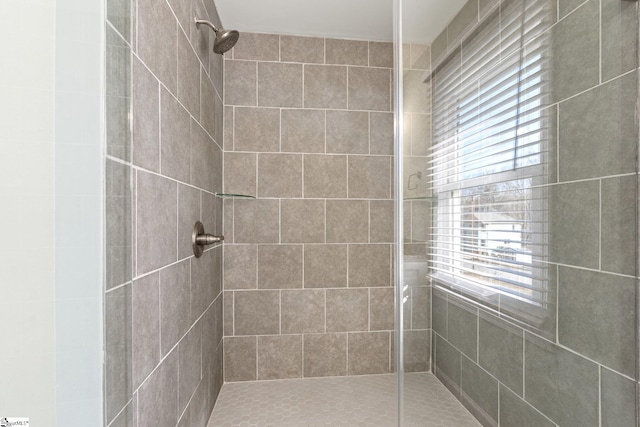 bathroom with tiled shower