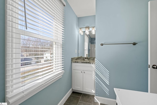 bathroom with tile patterned flooring and vanity