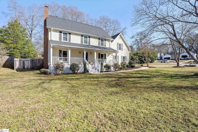 view of front facade with covered porch and a front yard