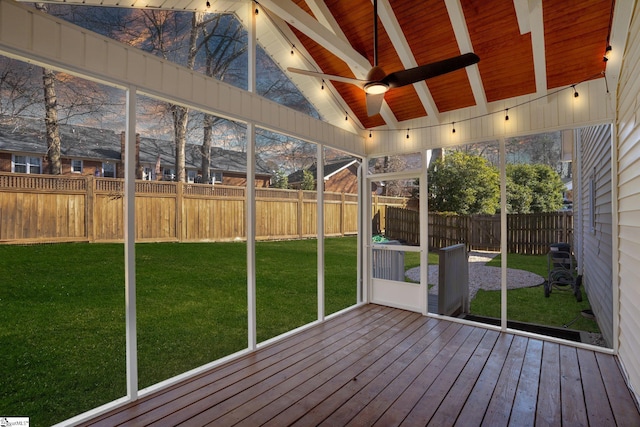 unfurnished sunroom with ceiling fan, vaulted ceiling with beams, and wood ceiling