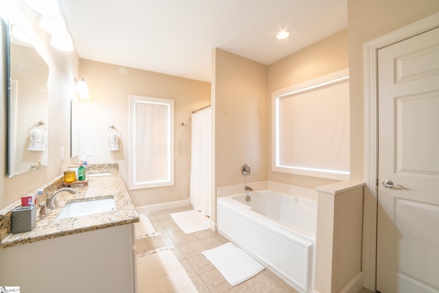 bathroom featuring tile patterned flooring, vanity, and shower with separate bathtub