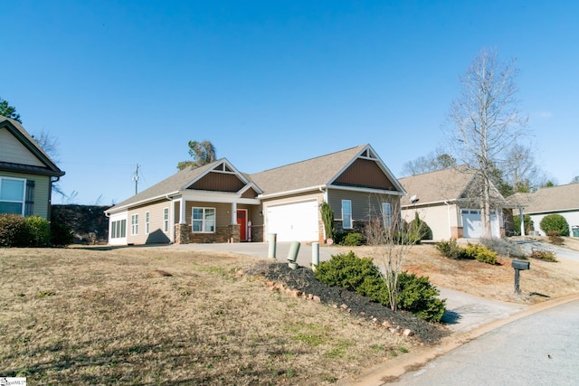 view of front of property with a garage and a front yard