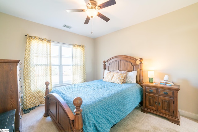 bedroom with light colored carpet and ceiling fan