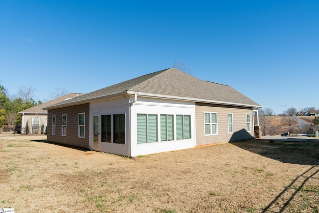 back of house with a yard