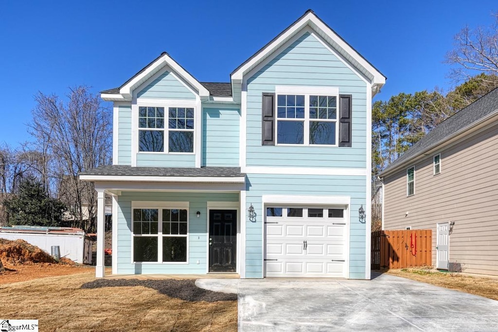 view of front of property with a garage