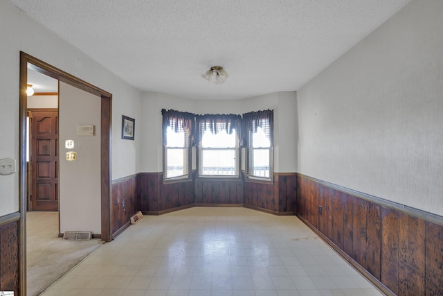 spare room with a textured ceiling