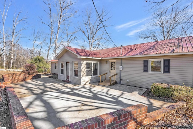 back of property featuring a patio area