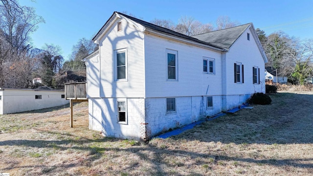 view of home's exterior with a yard