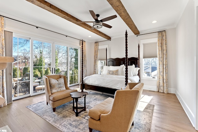 bedroom featuring access to exterior, beam ceiling, light hardwood / wood-style floors, and ceiling fan