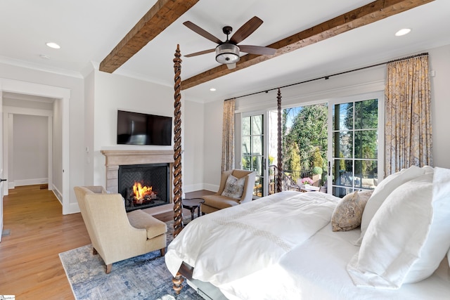 bedroom featuring ceiling fan, light hardwood / wood-style floors, and access to outside