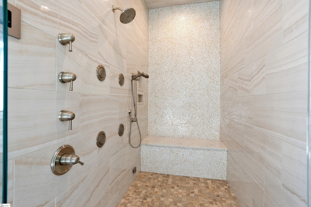 bathroom with tiled shower