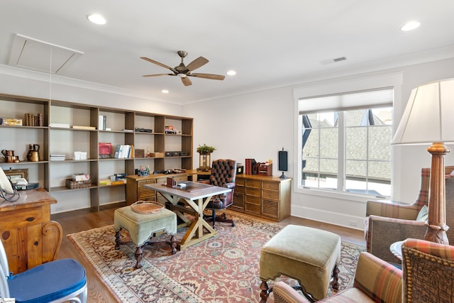 office space with ornamental molding, hardwood / wood-style floors, and ceiling fan