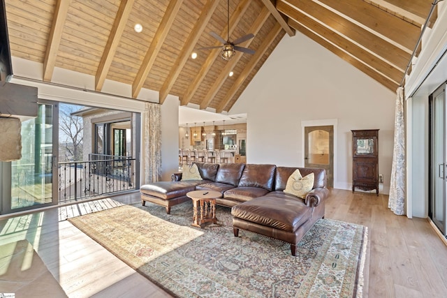 living room with beamed ceiling, wood ceiling, light hardwood / wood-style floors, and high vaulted ceiling