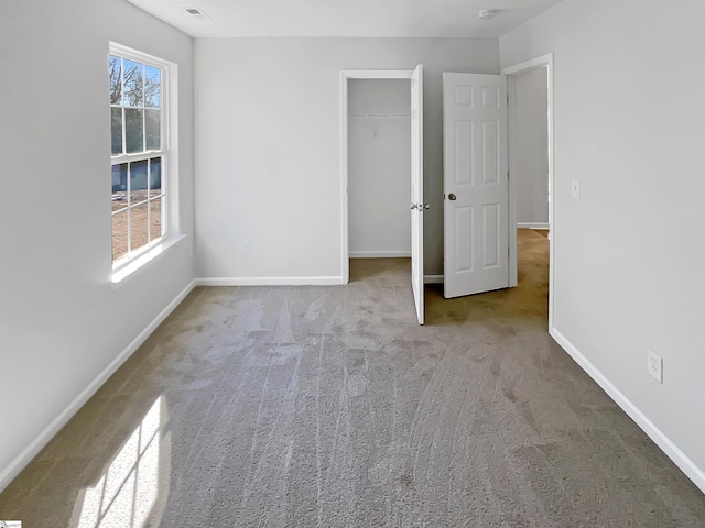 unfurnished bedroom with light carpet