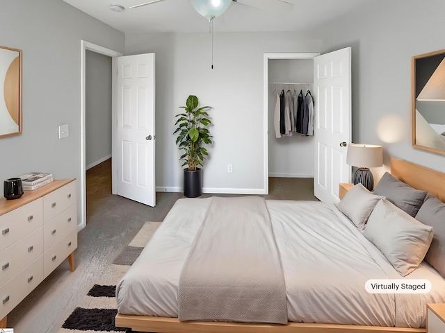 carpeted bedroom featuring ceiling fan and a closet