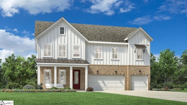 view of front of property with a garage and a front lawn