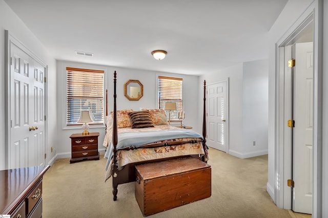 bedroom with light colored carpet