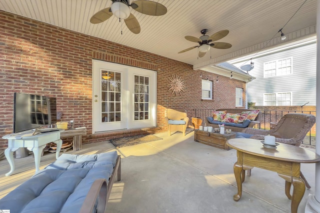 view of patio / terrace with french doors, ceiling fan, and an outdoor living space