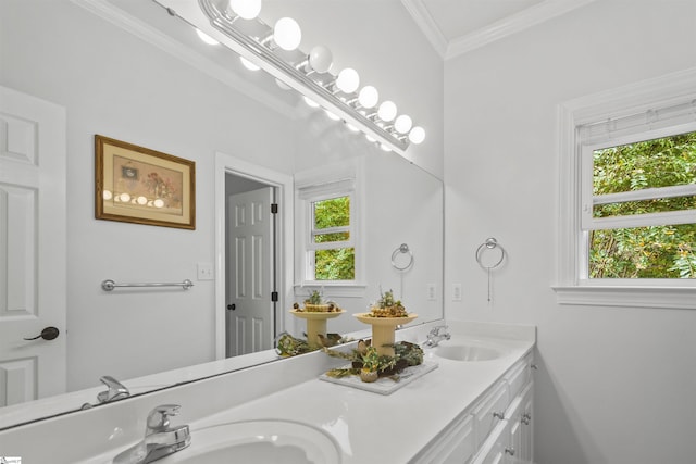 bathroom with vanity, crown molding, and plenty of natural light