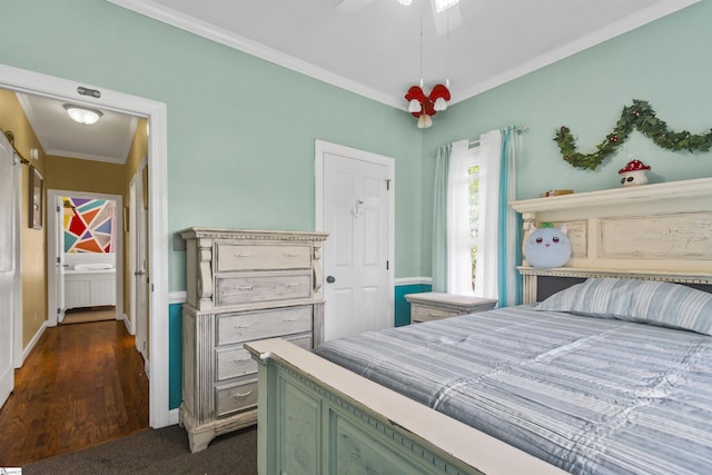 bedroom with ornamental molding, dark carpet, and ceiling fan