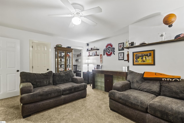 carpeted living room featuring ceiling fan