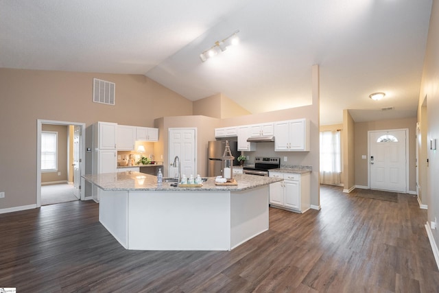 kitchen featuring stainless steel appliances, a kitchen island with sink, white cabinets, and light stone counters