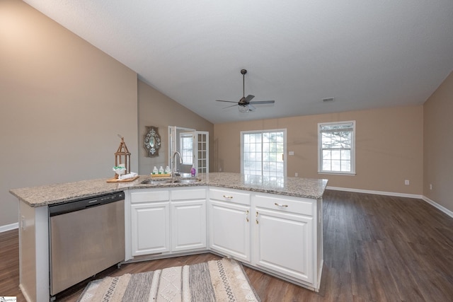 kitchen featuring white cabinetry, sink, stainless steel dishwasher, and an island with sink