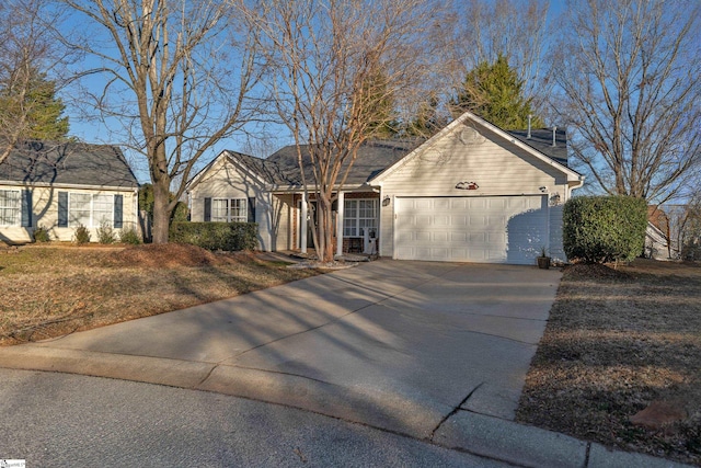 view of front of house with a garage and a front lawn