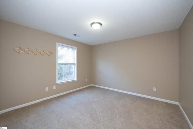 unfurnished room with carpet