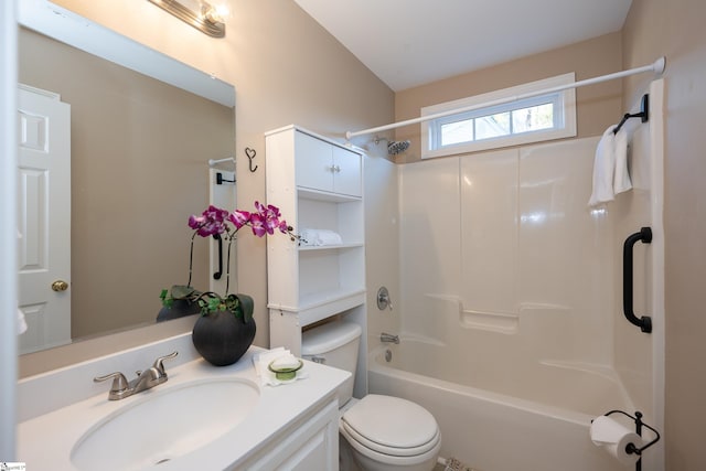 full bathroom featuring shower / tub combination, vanity, and toilet